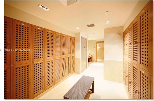 wine room featuring light carpet