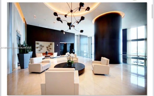 900 Biscayne Blvd Unit 4904, Miami, FL 33132 - common area with a wall of windows and a high ceiling
