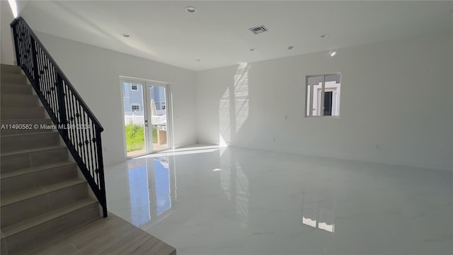 tiled spare room with french doors