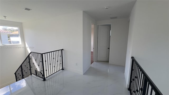 hallway with light tile floors