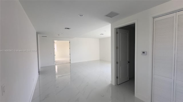 hallway with light tile floors