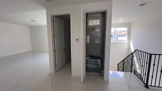 corridor featuring light tile flooring