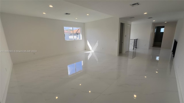 empty room featuring light tile floors