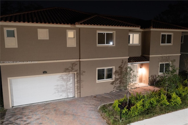 view of front of home with a garage