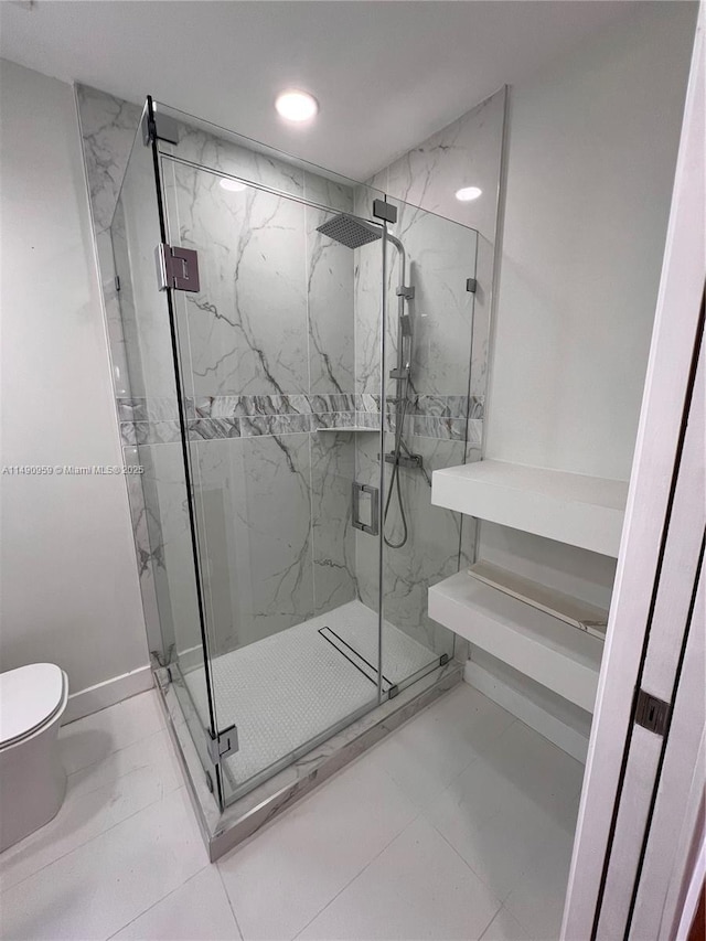 bathroom with toilet, a marble finish shower, baseboards, and recessed lighting