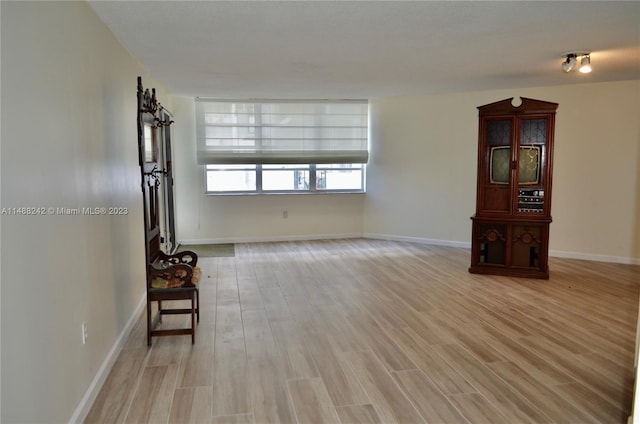 unfurnished living room featuring light wood-type flooring