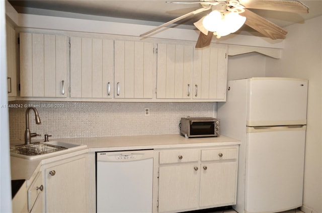 kitchen featuring backsplash, ceiling fan, white appliances, and sink