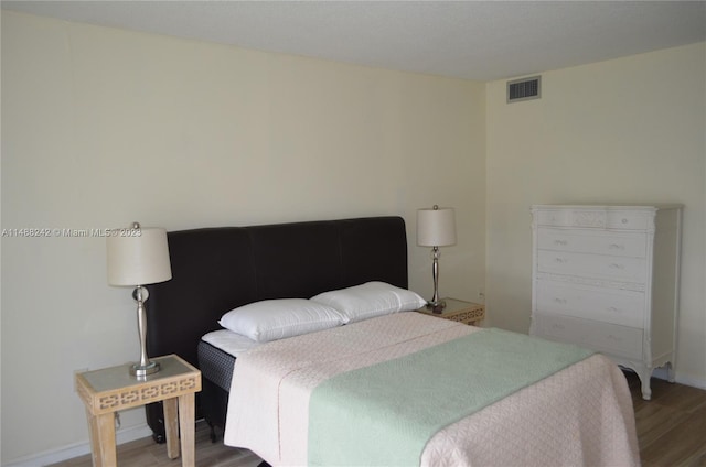 bedroom featuring dark wood-type flooring