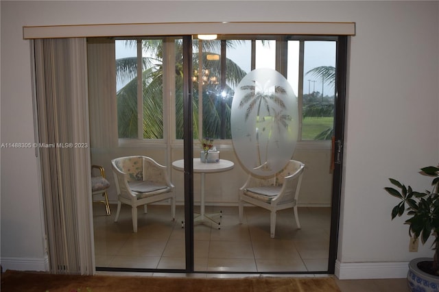 dining area featuring light tile floors