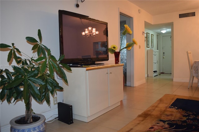 interior space with a notable chandelier and light tile flooring