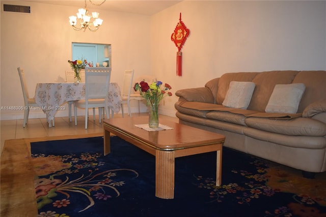 living room featuring an inviting chandelier and tile flooring