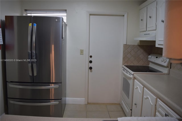 kitchen with custom exhaust hood, tasteful backsplash, white cabinetry, white electric stove, and stainless steel fridge