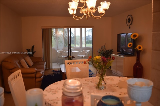 dining space with a notable chandelier