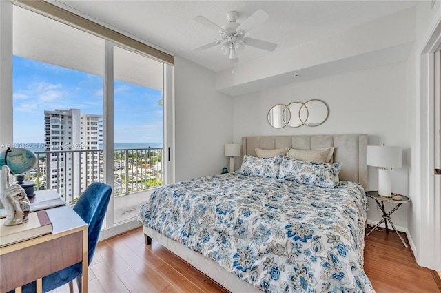 bedroom with wood-type flooring and ceiling fan