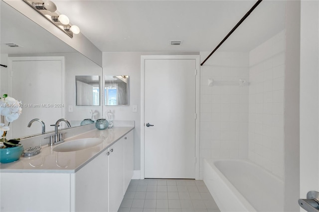 bathroom with vanity, tile patterned floors, and shower / bath combination