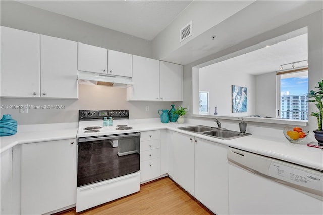 kitchen with white cabinetry, light wood-type flooring, sink, and white appliances