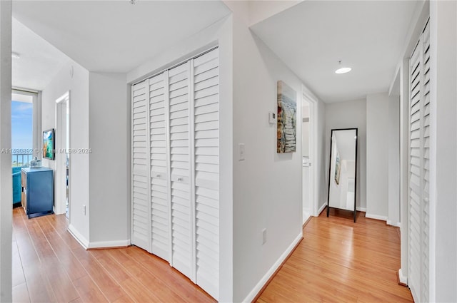 hall with light wood-type flooring