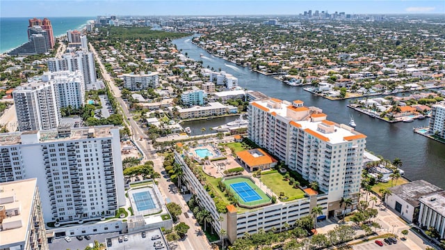 birds eye view of property with a water view