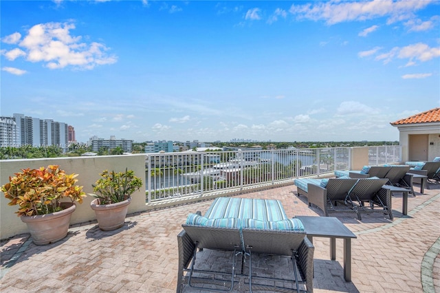 view of patio with outdoor lounge area and a water view