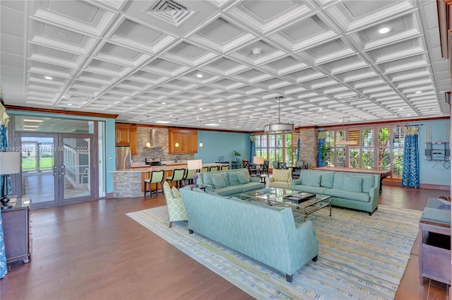 living room featuring wood-type flooring and coffered ceiling