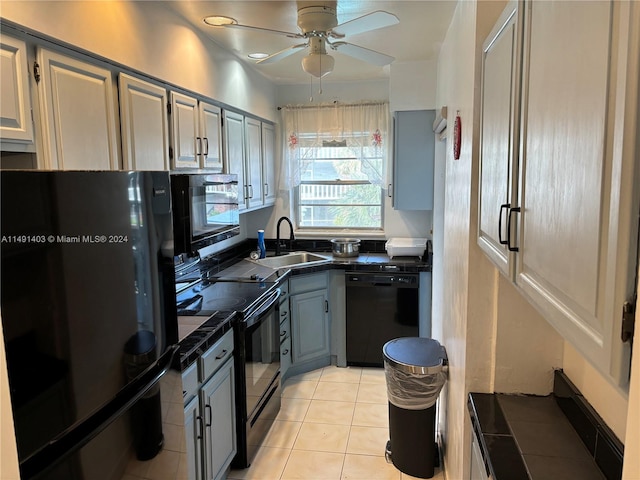 kitchen featuring sink, black appliances, light tile patterned flooring, gray cabinets, and ceiling fan