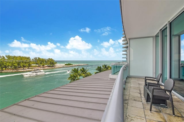 balcony featuring a water view