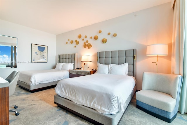 bedroom featuring light colored carpet