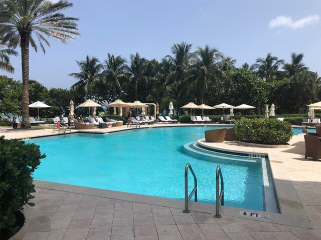 view of swimming pool with a patio