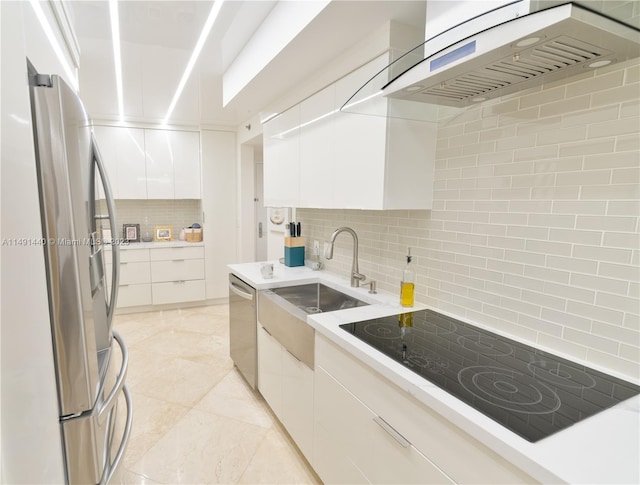 kitchen featuring sink, light tile floors, stainless steel appliances, custom exhaust hood, and white cabinetry