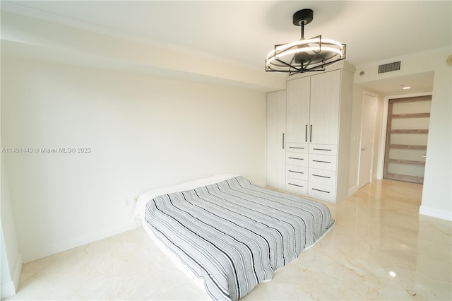 bedroom featuring a closet and light tile floors