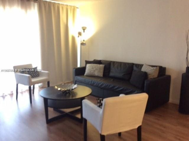 living room featuring dark hardwood / wood-style flooring