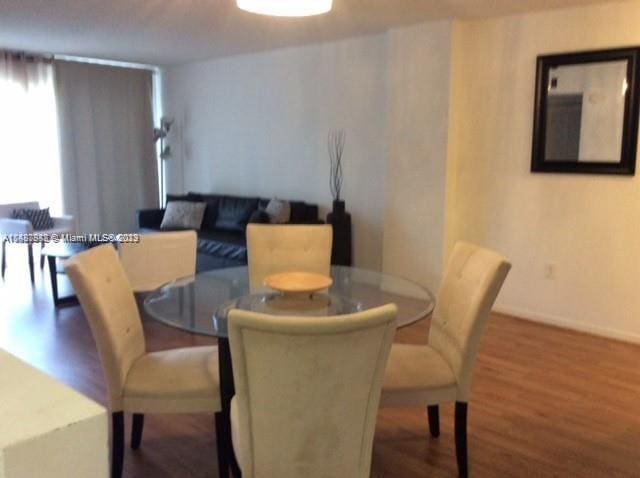 dining room featuring dark wood-type flooring