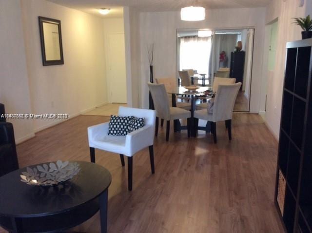 dining space featuring hardwood / wood-style flooring