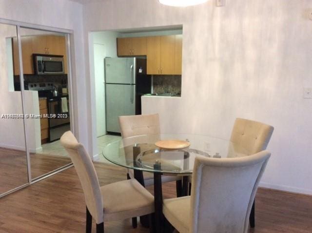 dining area featuring hardwood / wood-style floors