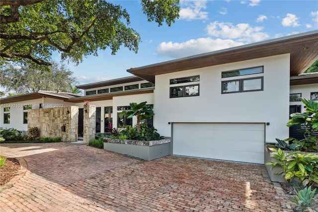 view of front of property with a garage