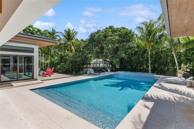 view of pool featuring a patio