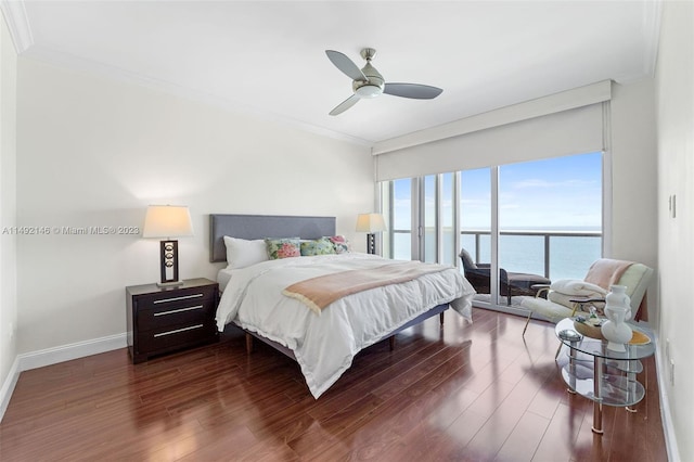 bedroom with access to exterior, a water view, ceiling fan, wood-type flooring, and crown molding