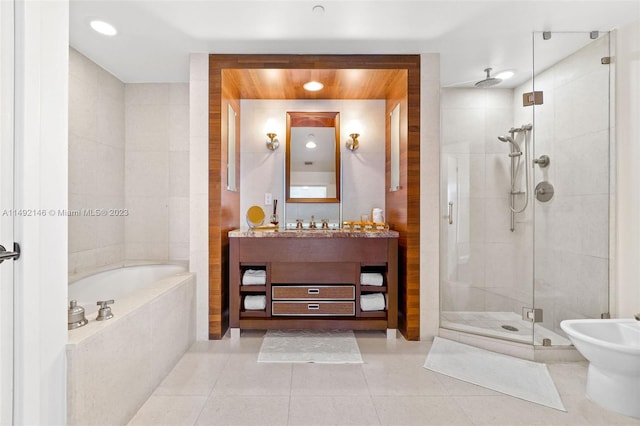 bathroom featuring a bidet, tile patterned flooring, independent shower and bath, and vanity