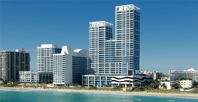 city view with a water view and a view of the beach