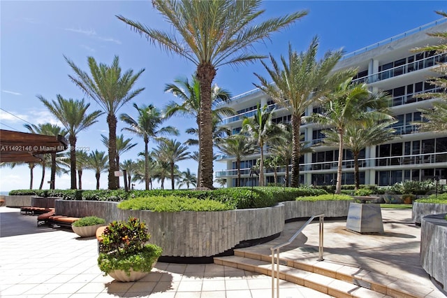 view of home's community with a patio area