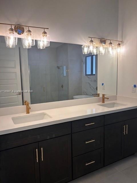 full bath featuring a sink, double vanity, and a shower stall