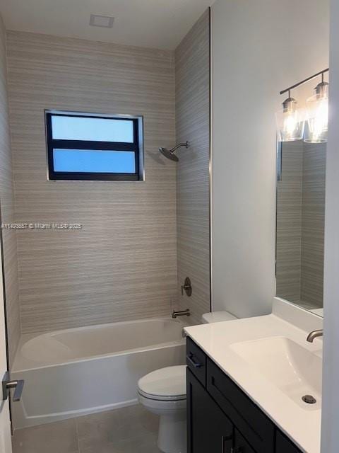 bathroom with tile patterned flooring, tub / shower combination, toilet, and vanity