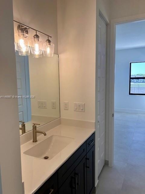 bathroom with vanity and baseboards