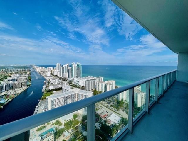 balcony featuring a water view