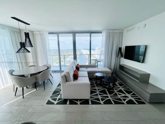 living room featuring light tile floors and expansive windows