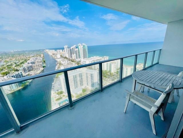 balcony featuring a water view