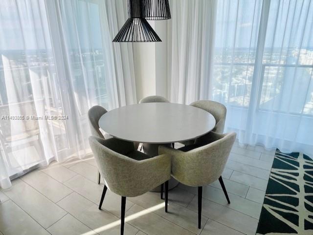 dining area with light tile flooring