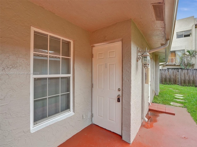 entrance to property with a yard