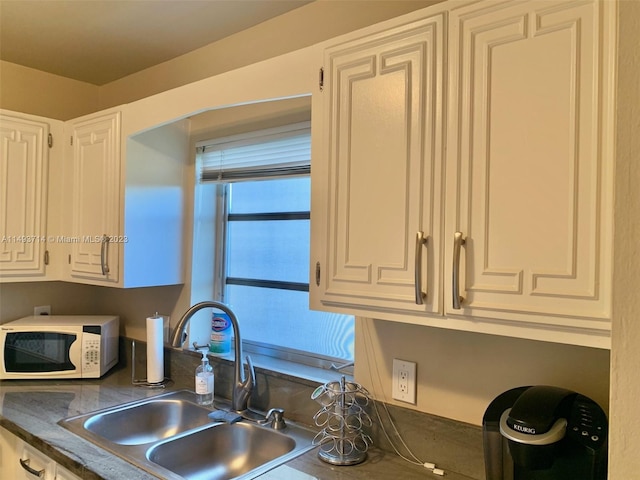 kitchen with white cabinets and sink