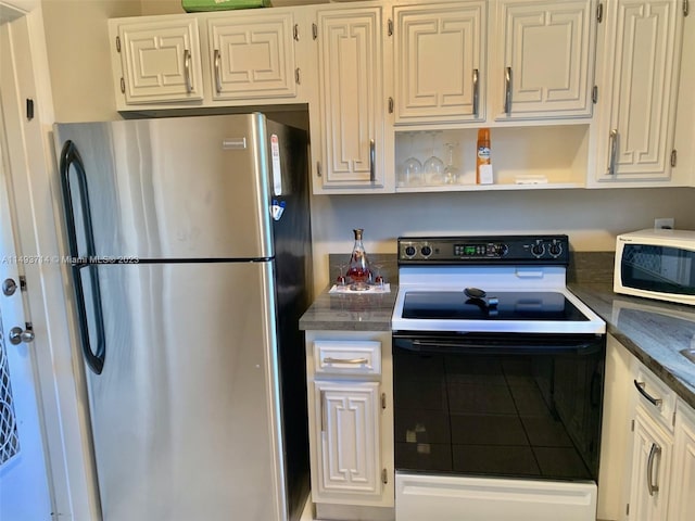 kitchen with white appliances and white cabinetry